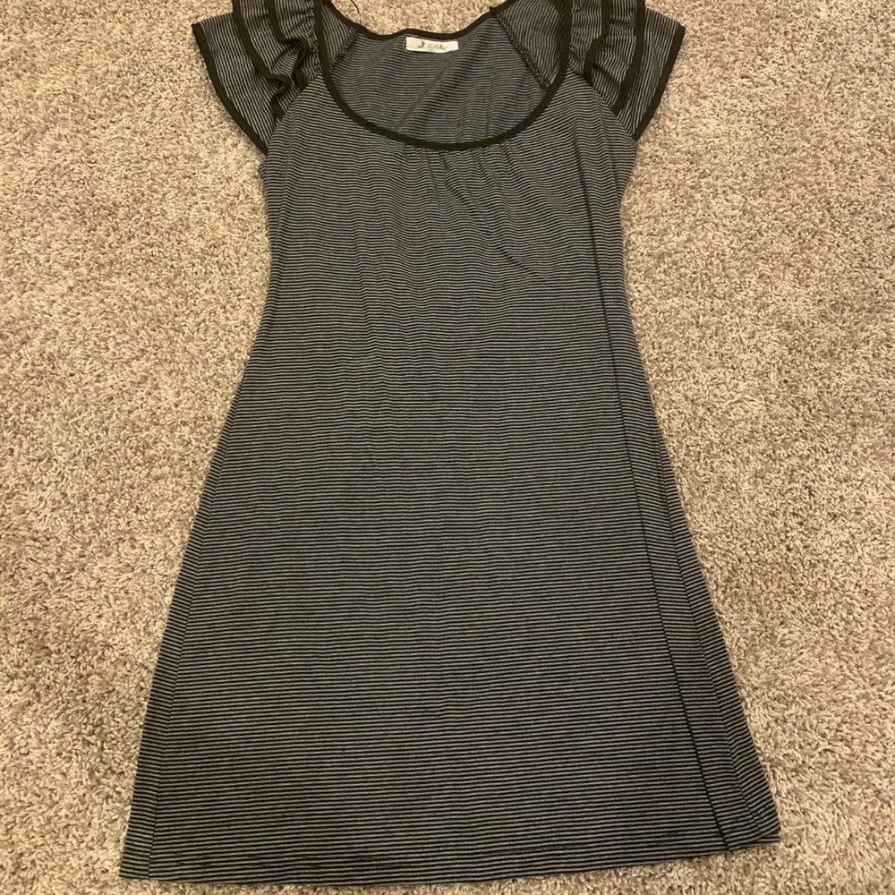 cotton mini dress with shoulder ruffles.